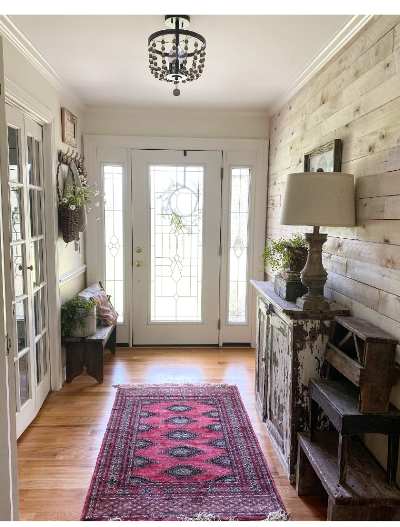 Entry way with bold vintage rug 
