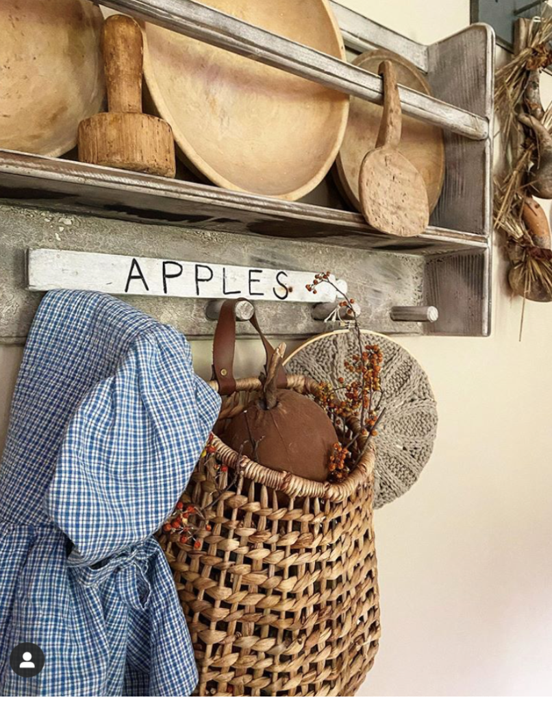 peg rack with bonnet and basket and sweater hoop